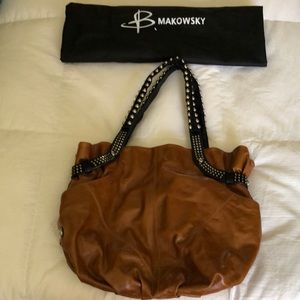 B Makowsky whiskey brown leather shoulder bag with black leather/rivet straps.